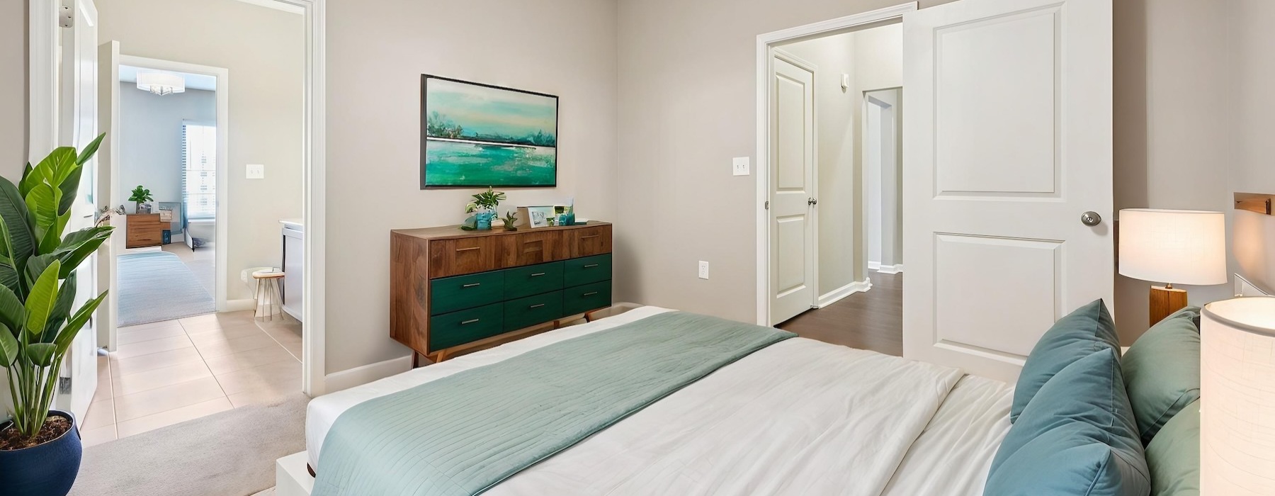a bedroom with a bed and a dresser