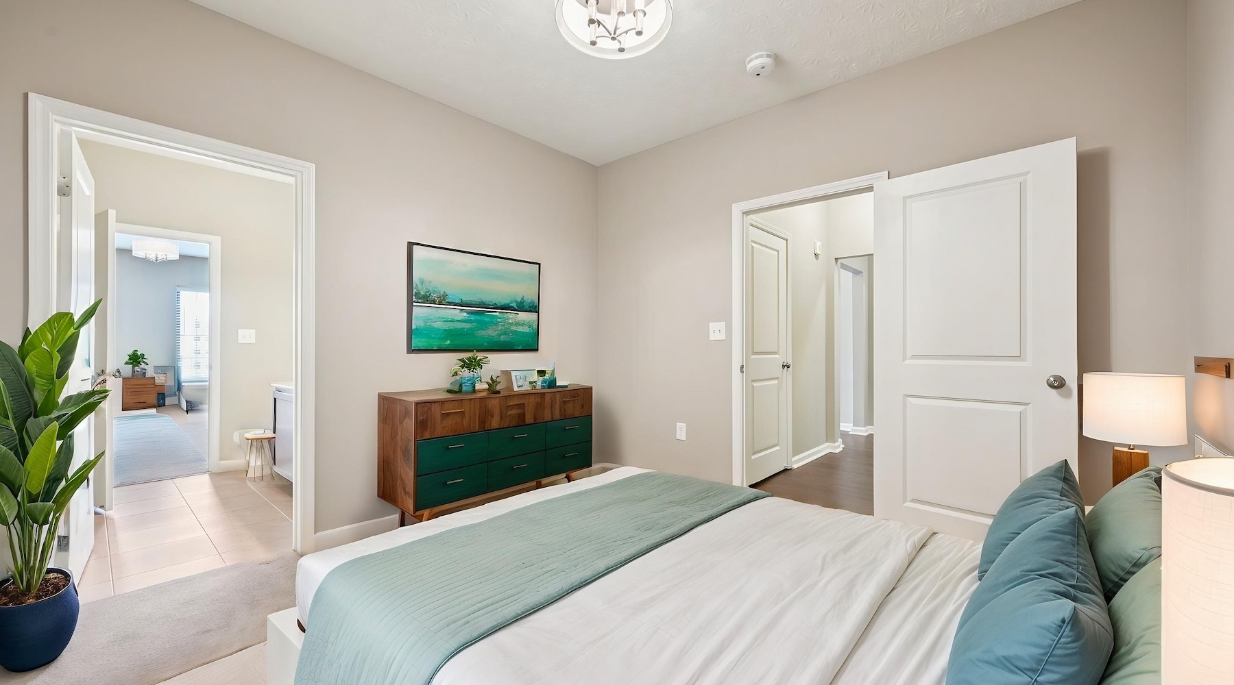 a bedroom with a bed and a dresser