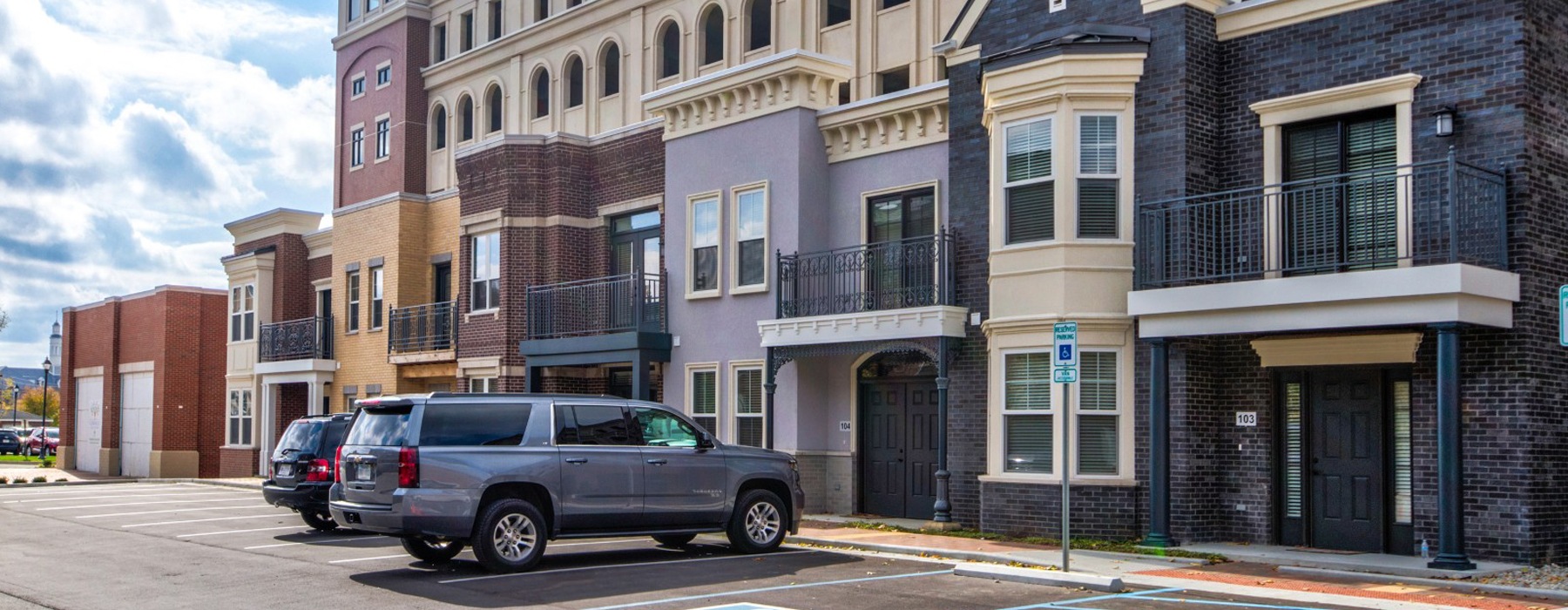 cars parked in front of a building